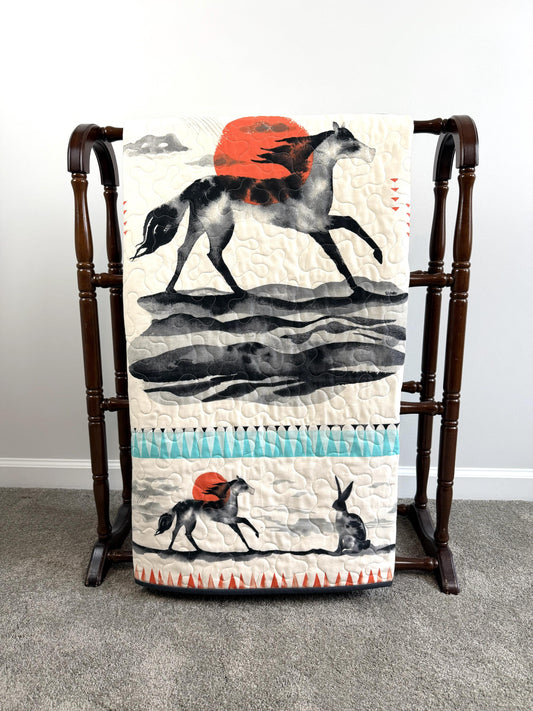 Horse Running Under a Sun Filled Sky Throw Quilt